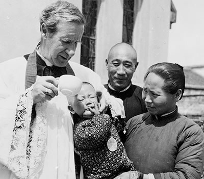 Bishop Galvin baptising and infant